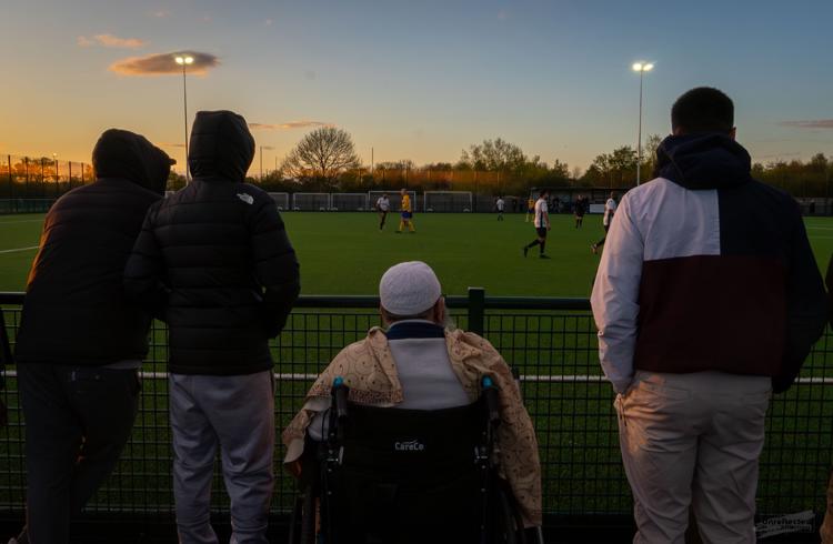 Four Men Watching Sport At Hartpury