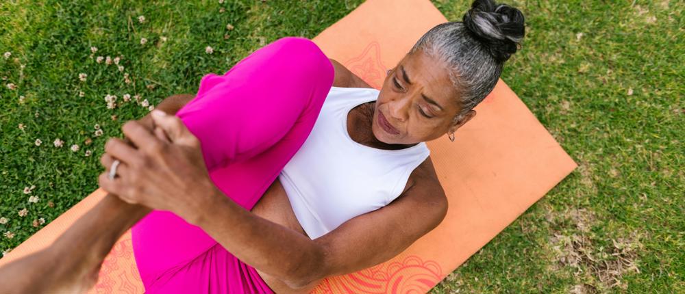 Lady Performing Yoga On Mat