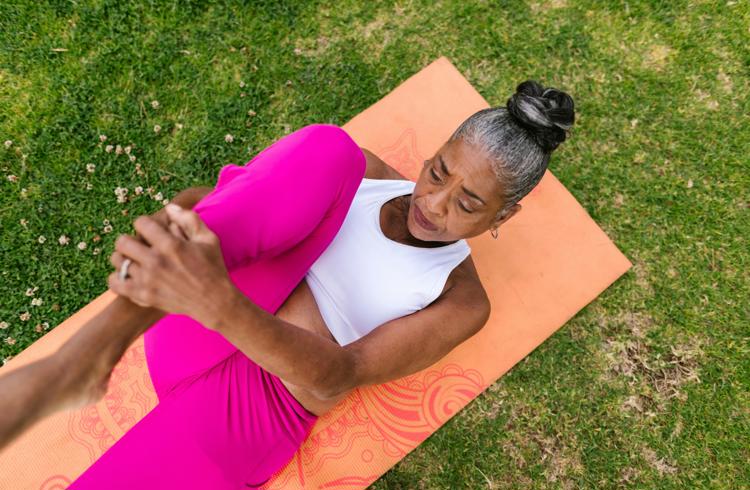 Lady Performing Yoga On Mat