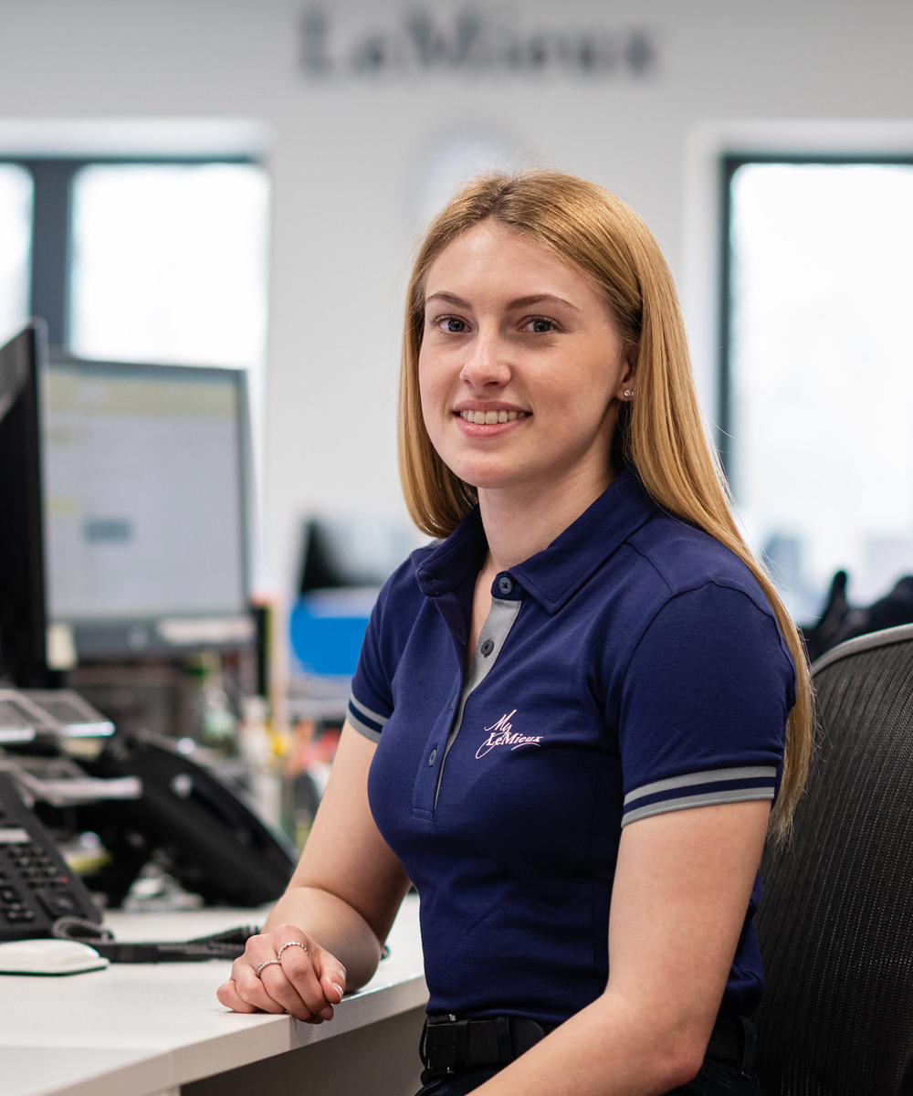 University Alumni Megan Batchelor working at a computer