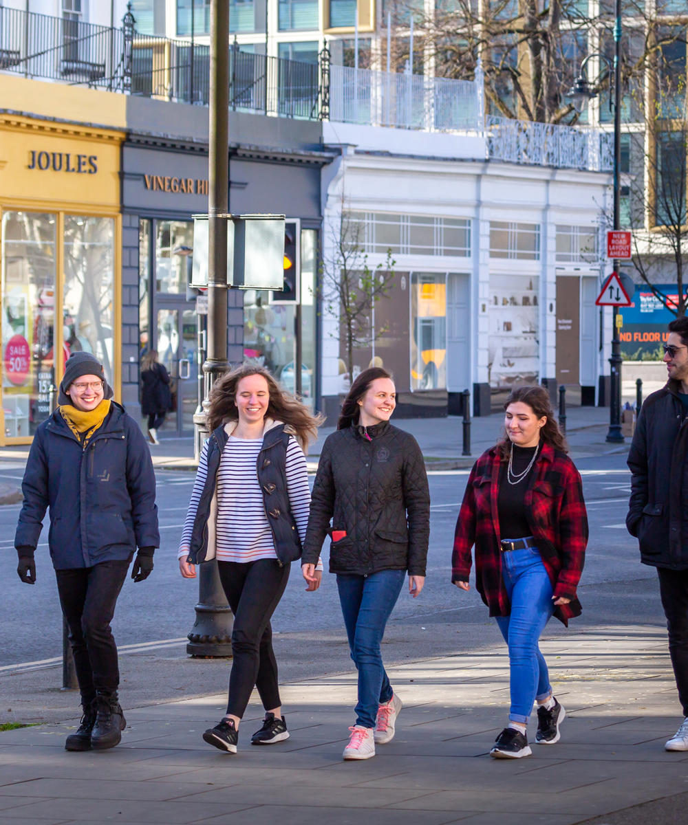 Students Walking Along Street In Cheltenham