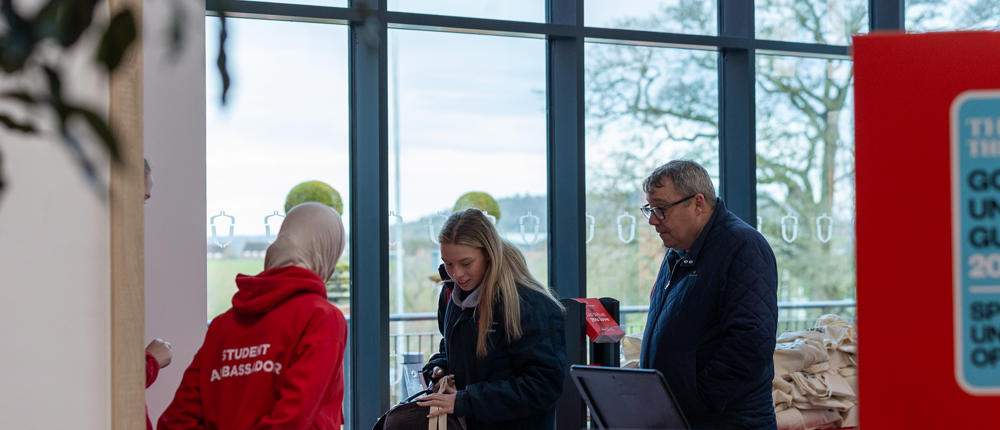Student Ambassador Greets Guests At Open Event