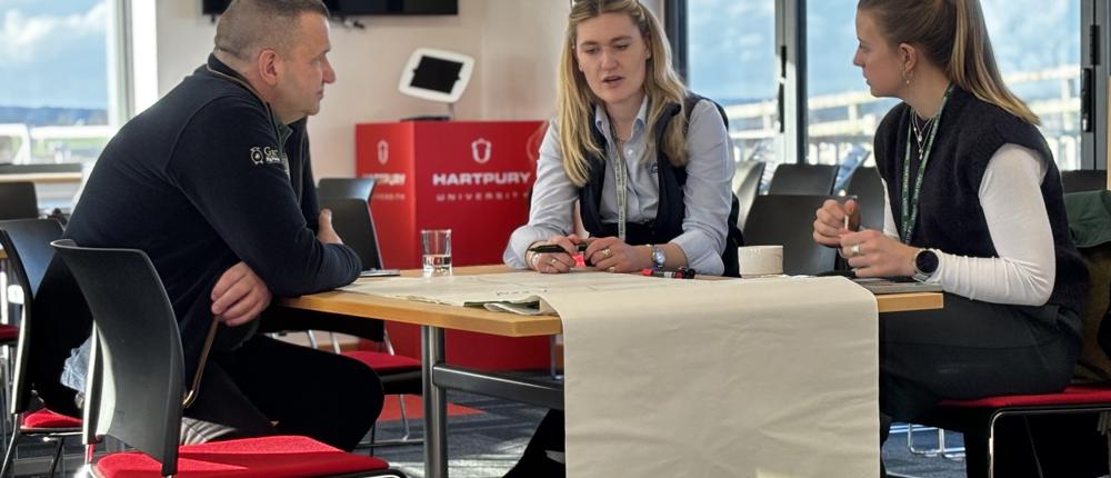 Three Pigtech Delegates At Table